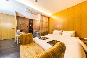 Postel nebo postele na pokoji v ubytování Hotel Cullinan Wangsimni