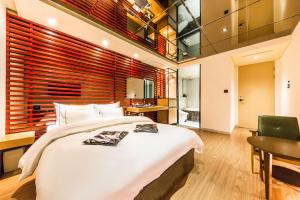 Letto o letti in una camera di Hotel Cullinan Wangsimni