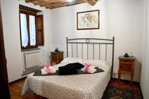 Postel nebo postele na pokoji v ubytování Palazzo Granaroli