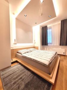 Postel nebo postele na pokoji v ubytování Apartman Maja, Apart-hotel Zlatni javor