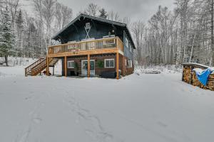 a log cabin in the snow with snow covered ground at Fresh and Retro Chalet Fire Pit, 4 Min to Gore Mtn in North Creek