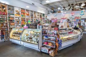 a grocery store aisle with a display of food at Just for Fun 2 in Santa Rosa Beach