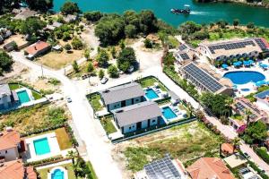 an aerial view of a house with a swimming pool at Dalyan Villa Petra in Dalyan
