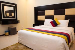 Postel nebo postele na pokoji v ubytování تارا واحد للشقق المخدومة + 29 fotografií