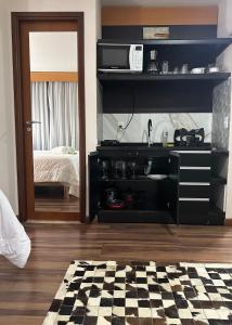 a living room with a sink and a checkered floor at Mercure São Paulo vila Olimpia premium in Sao Paulo