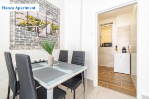 a dining room with a table and chairs at O2 Arena - Honza Apartment Praha in Prague