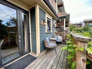 a front porch of a house with a chair and a door at Vineyard Suite at The Inn On The Drive in Vancouver