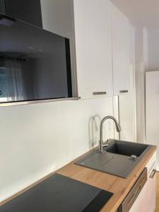 a kitchen with a sink and a microwave at The perfect Place in Rohrau +6 photos
