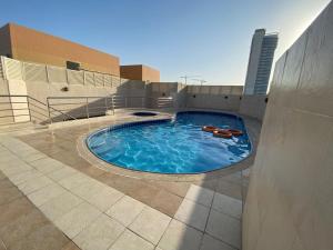 a swimming pool on top of a building at Beautiful Bedroom in Al Barsha Near Mashreq Metro in Dubai