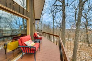 a balcony with chairs and tables on a house at Eclectic Hubertus Home with Game Room and Fire Pit! in Germantown