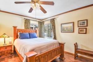 a bedroom with a bed and a ceiling fan at Relax in Frontier Retreat - Bordering Forest Service! in Flagstaff