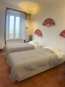 Postel nebo postele na pokoji v ubytování Peniche Hostel