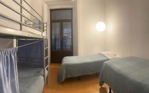 Postel nebo postele na pokoji v ubytování Peniche Hostel