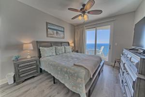 a bedroom with a bed and a view of the ocean at OCEAN FRONT CONDO w INCREDIBLE VIEWS in Panama City Beach