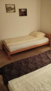 a bed in a room with a bed frame at Apartman B&B in Pale