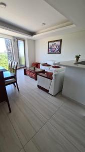 a large living room with a table and chairs at Luxury apartment in the most privileged area - SC in Santa Cruz de la Sierra