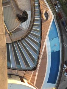 an overhead view of a spiral building with a swimming pool at Luxury apartment in the most privileged area - SC in Santa Cruz de la Sierra