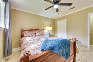 a bedroom with a bed and a ceiling fan at Baton Rouge Vacation Rental with Yard 10 Mi to LSU! in Baton Rouge