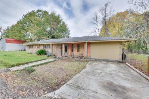 a house with a driveway in front of it at Baton Rouge Vacation Rental with Yard 10 Mi to LSU! in Baton Rouge