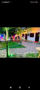 a photograph of a courtyard with a palm tree at Transit house in Katunayake