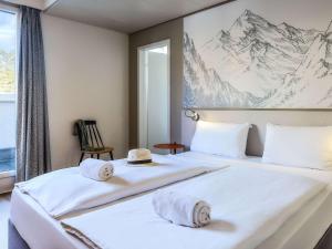 Uma cama ou camas num quarto em ibis Styles Luzern