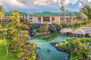 an aerial view of a resort with a river at Grand Hyatt Kauai Resort & Spa in Koloa