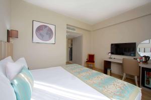 Postel nebo postele na pokoji v ubytování Ramada By Wyndham Soma