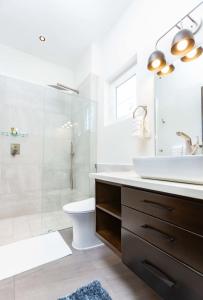 a bathroom with a sink toilet and a shower at Villa Blue Amber Cabarete in Cabarete
