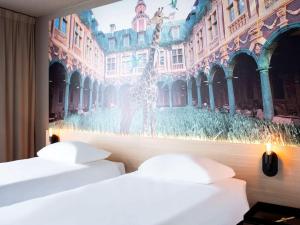 Postel nebo postele na pokoji v ubytování ibis Styles Lille Neuville en Ferrain
