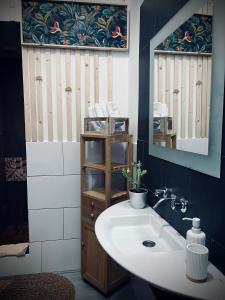a bathroom with a sink and a mirror at Studio Plaza Molino del Gofio Only Adults in Granadilla de Abona