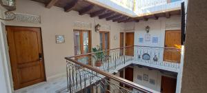 a hallway of a building with a balcony at Hotel Ansi Boutique W&S terrace in Bukhara