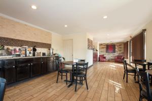 a kitchen with a table and chairs in a room at Red Roof Inn Santee in Santee