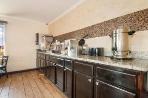 a kitchen with a counter and a counter top at Red Roof Inn Santee in Santee