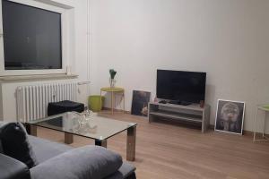 TV a/nebo společenská místnost v ubytování Apartment mit großem Balkon
