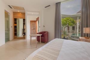 Ein Bett oder Betten in einem Zimmer der Unterkunft Taman Mesari Luxury Villas-Seminyak