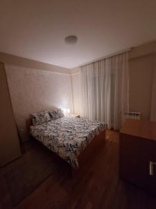 Uma cama ou camas num quarto em SAN