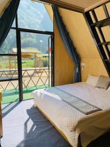 Postel nebo postele na pokoji v ubytování Bungalow Pả Vi