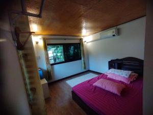 Postel nebo postele na pokoji v ubytování Mont Lan Chang ม่อนล้านช้าง เวียงแหง เชียงใหม่