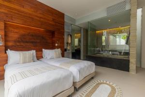Ein Bett oder Betten in einem Zimmer der Unterkunft Taman Mesari Luxury Villas-Seminyak