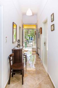 a hallway with a chair and a table in a house at Holiday home in Ston 7005 in Ston