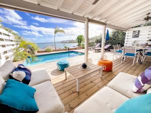 a living room with a view of the ocean at Little Paradise 1, 3 bedrooms, private pool, Cul de Sac Bay view in Cul de Sac