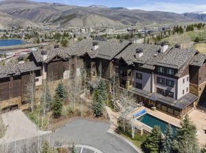 an aerial view of a house with a swimming pool at Beaver Creek Landing A406 condo in Avon