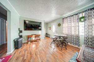 a living room with a table and a tv at Ashtabula Home Rental - 2 Mi to Lake Erie, Beaches in Ashtabula