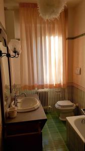 a bathroom with a sink and a toilet at Apartment in Montepulciano/Toskana 36866 in Montepulciano