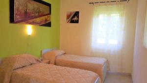 Postel nebo postele na pokoji v ubytování Apartments Capo Vaticano - Kalabrien 21016