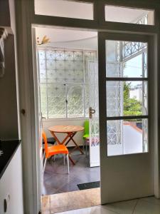 a door leading into a dining room with a table at Villa Pierrette Casablanca in Casablanca