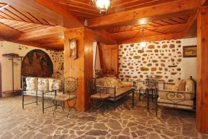 a living room with couches and chairs in a building at Despot Slav Hotel & Restaurant in Melnik