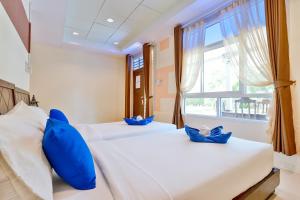 Postel nebo postele na pokoji v ubytování Aonang Privacy Resort