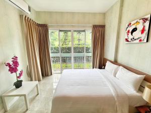 Ένα ή περισσότερα κρεβάτια σε δωμάτιο στο ฺBaan Khaoyai by Madam +10 φωτογραφίες