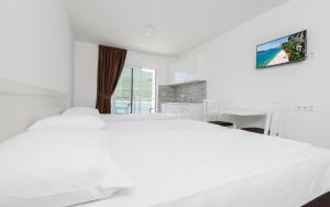 Llit o llits en una habitació de Apartments Villa Luce